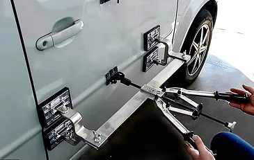 Glue pulling rig on a van door panel